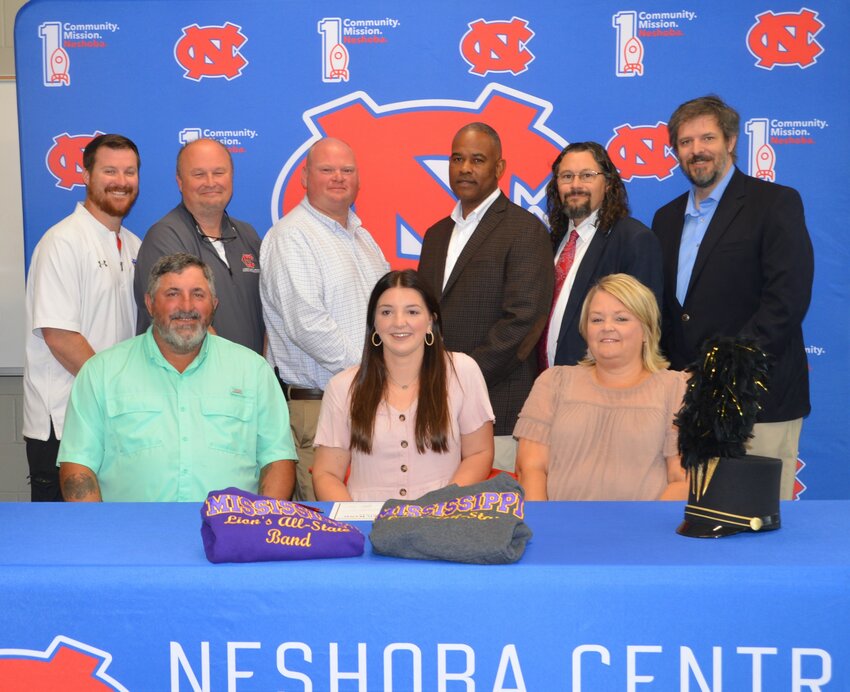 Neshoba Central’s Katie Ward signed with East Central Community College to further her education and be a member of the Wall O’ Sound Band. Pictured, front row from left, are her father Billy Ward, Katie Ward and her mother Shay Ward (Back) Assistant Principal Jonathan Walker, Principal Jason Gentry, Assistant Principal Brent Pouncy Assistant Principal LaShon Horne, Her brother Shot Stribling, Josh Burton and Band Director Daniel Wade, and ECCC Representative Justin Sharp.
